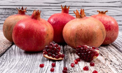 fresh pomegranate on wooden table